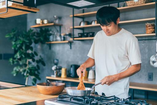 料理をする男性のイメージ画像