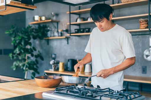 男性が料理をするイメージ画像